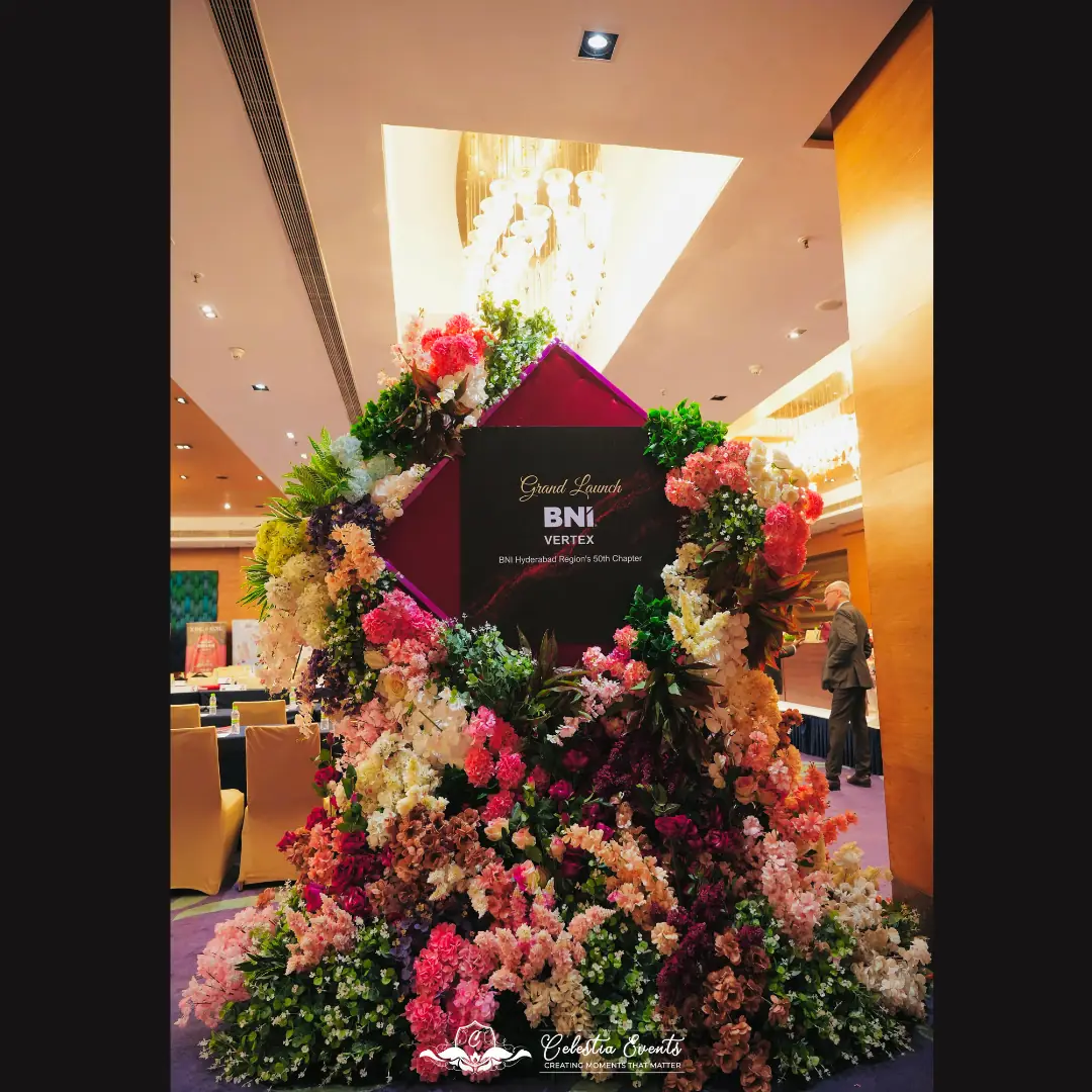 Floral installation with BNI Vertex signage
