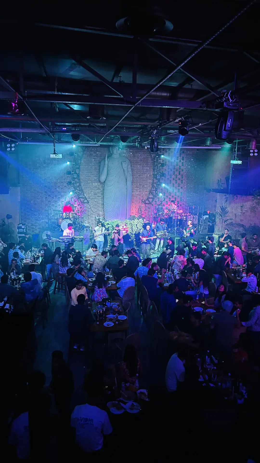 Concert crowd under blue and pink stage lights