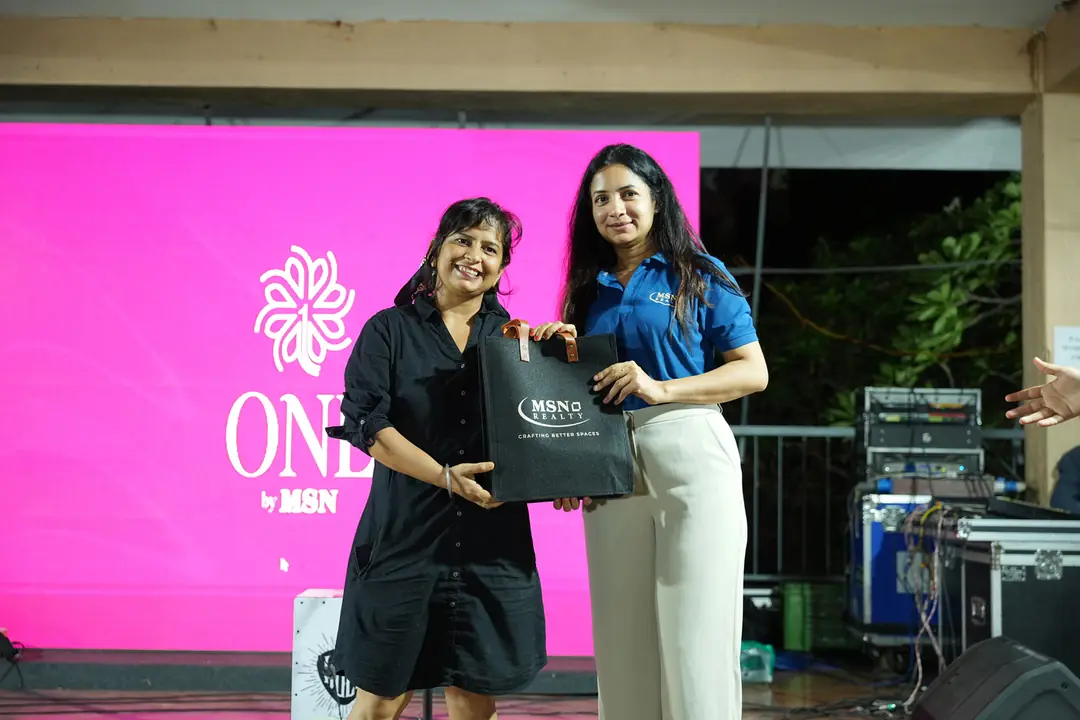 MSN Realty team presenting a gift to a resident